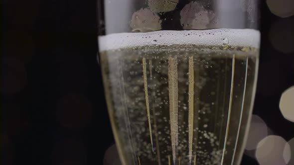 Close Up of a Glass of Champagne. Bokeh Background. Close Up