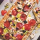 A Piece of Square Pizza with Basil Pepperoni Tomatoes and Mushrooms on a Iron Tray - VideoHive Item for Sale