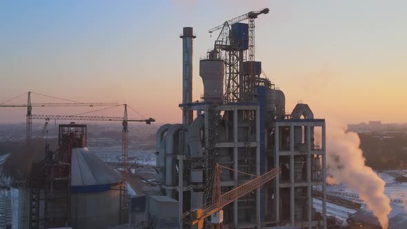 Aerial View of Cement Factory with High Concrete Plant Structure and Tower Crane at Industrial