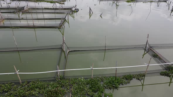 Aerial view of traditional floating fish pond on swamp in Indonesia