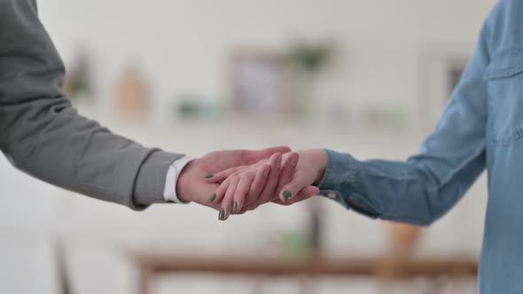 Close Up of Couple Holding Hands