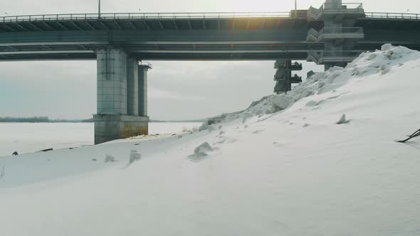 Trucks Drive Along Huge Bridge Near Old Rusty Pier Upper