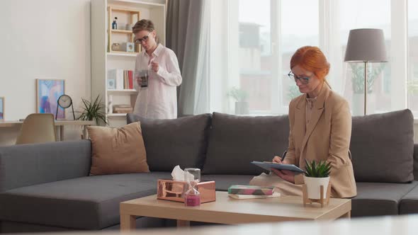 Female Patient Walking around Therapy Office