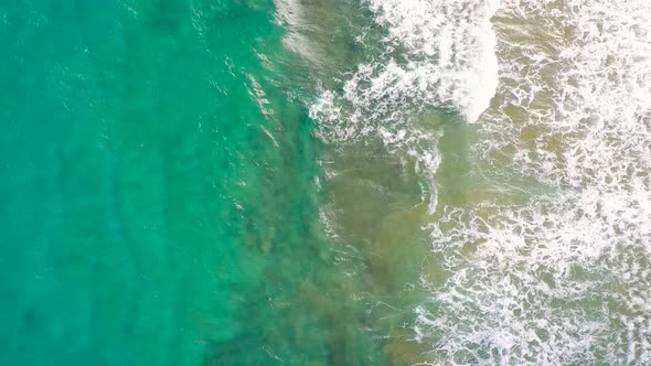 Aerial View of the Mediterranean Coast Waves Reach the Deserted Sandy Beach