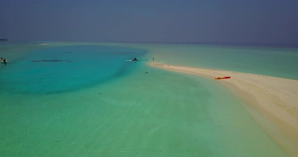 Beautiful above travel shot of a paradise sunny white sand beach and blue sea background in high res