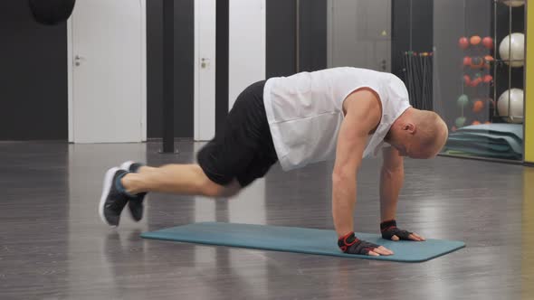 Young European Man Doing Sports doing Abs Exercise In the Gym, Training self-Development