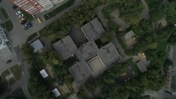 Top down Aerial view of empty preschool building. Camera rotates 19
