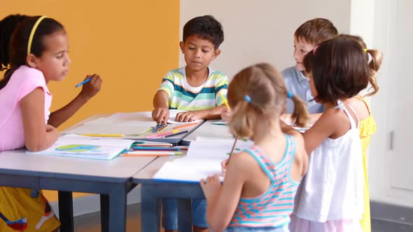 School kids studying in classroom