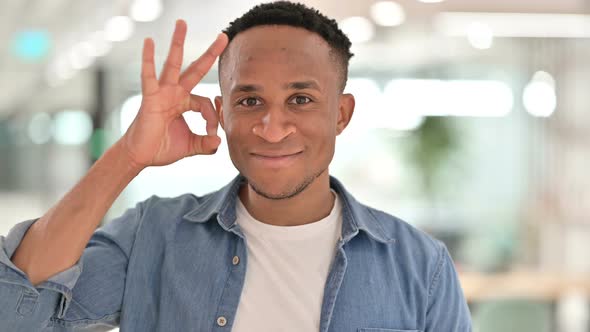 Portrait of Casual African Man Showing Ok Sign By Hand 