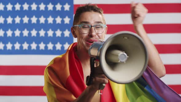 Gay Man Giving Emotional Speech with Loudspeaker