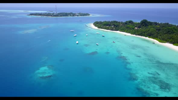 Aerial drone shot texture of paradise resort beach lifestyle by transparent ocean and white sand bac