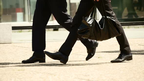 Businessmen Walking on City Street going to Work