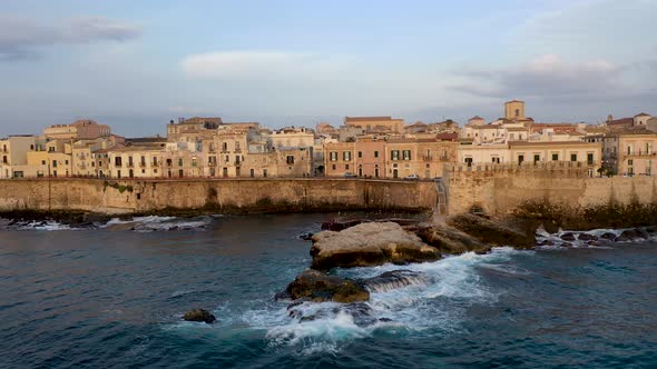 View of the Embankment of the Island of Ortigia During Sunrise. Bird's Eye View. Sicily. Italy