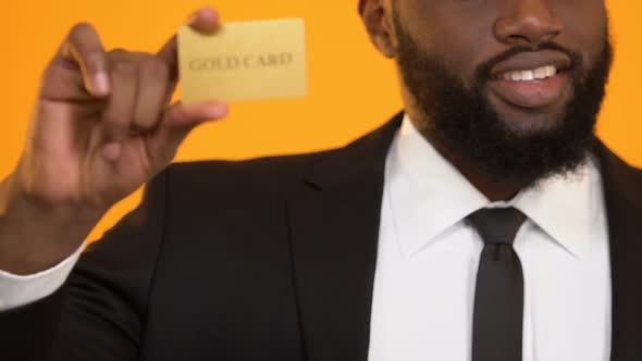 Successful African-American Oligarch Holding Golden Credit Card Rich People Life