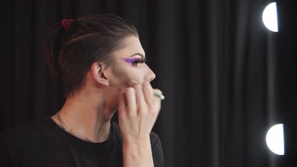 Drag Artist  Young Man Blending in the Contours on His Cheeks
