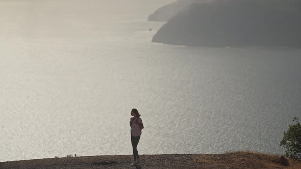 Silhouette of Young Woman Tourist Enjoying Beautiful Seascape of Aegean Coastline Mediterranean Sea