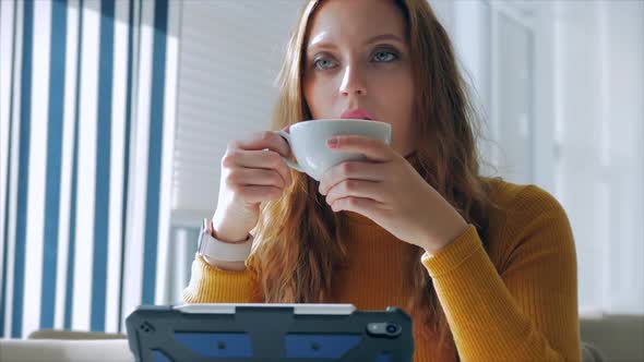 Portrait Close Up of Happy Pretty Young Woman, Girl Sitting in a Cafe Working on a Laptop