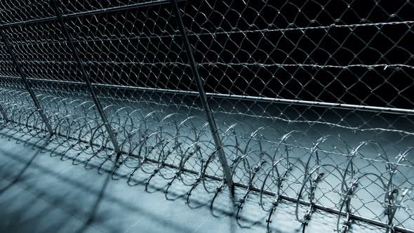 Endless footage showing the whole prison fence at night. Jail protection. 4k HD