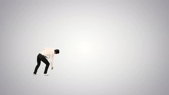 Young Energetic Businessman Doing Several Flips on Gradient Background.