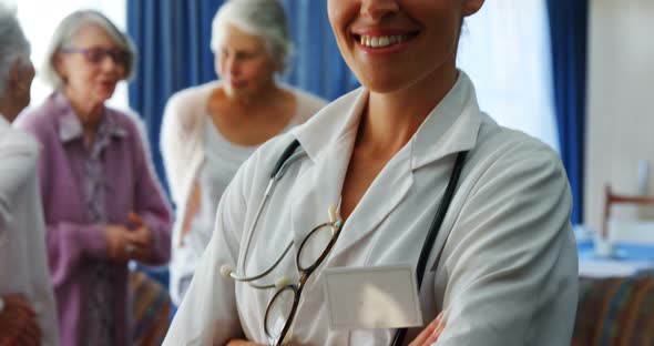 Portrait of female doctor standing with arms crossed 4k