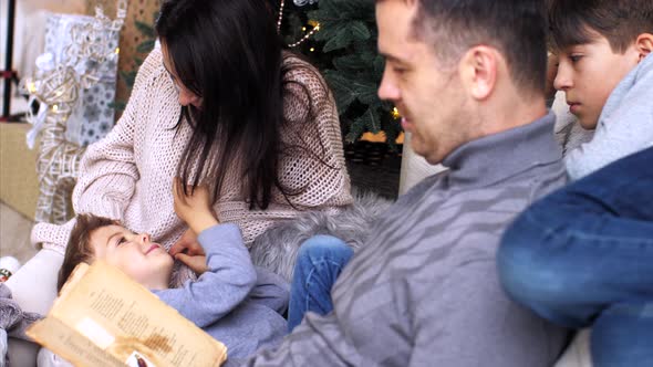 Family is Spending Time Together at Home in Christmas Eve