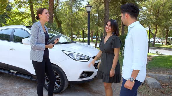 A Couple Purchases A New Car 