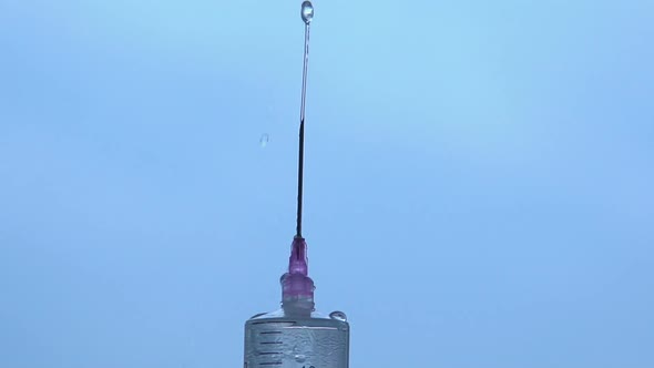Closeup Shot of Liquid Jet Pulsing From Injector Needle, Problems With Urination
