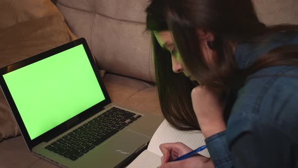 Portrait of Woman Calling Video on Laptop Green Screen Chromakey