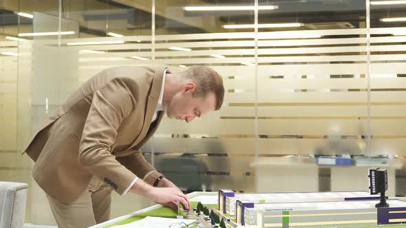 Portrait of Architect Man Working with House Building Project Planning Playground Yard Near the