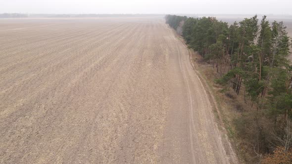 Empty Plowed Field in Autumn Aerial View