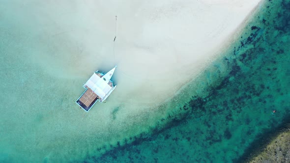 Luxury drone travel shot of a white paradise beach and aqua blue water background in 4K