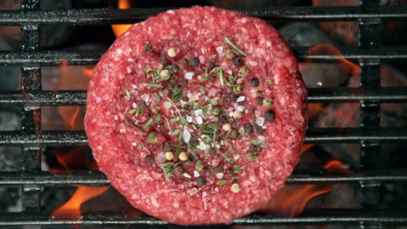 Super Slow Motion Top Shot of Falling Fresh Minced Meat with Spices on Grill at 1000 Fps