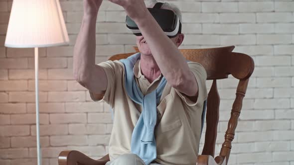 Gesturing Old Man in VR Headset