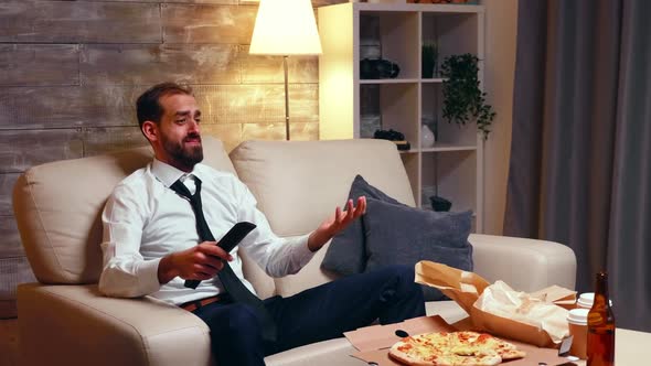 Tired Entrepreneur Watching Tv in Living Room