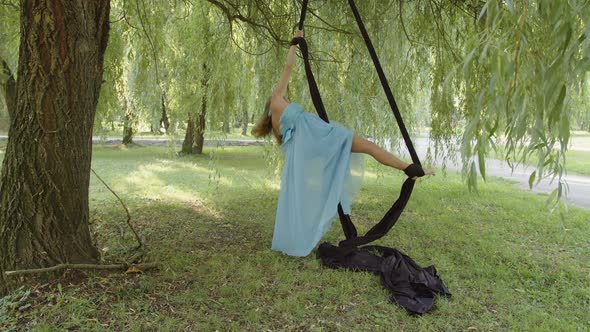 Movements of a Girl on Black Aerial Silk