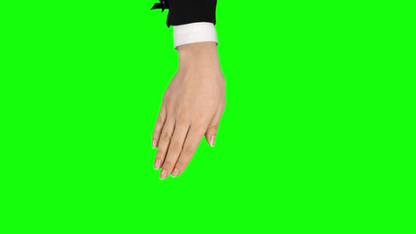 Female Hand in Black Jacket Is Performing 5x Rotate Left and Right at Tablet Screen Gesture on Green