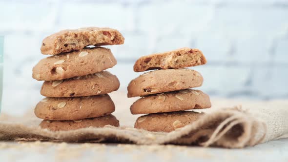 Stack of Oat Cookies and Milk on Black Background