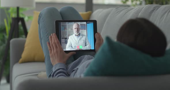 Woman having a video chat with her doctor