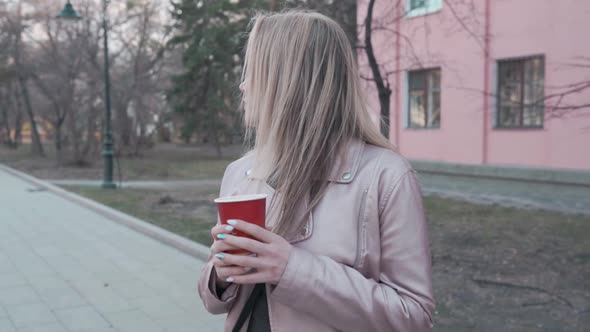 Slow Motion of Happy Young Woman Walking Outdoors in City Street