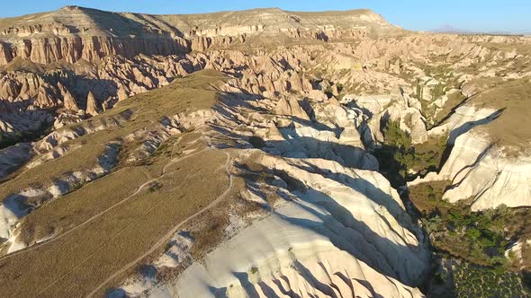 Hoodoos, Fairy Chimneys and Sedimentary Volcanic Rock Formations in Eroded Cappadocia Valley Avanos