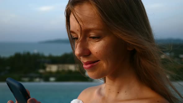 Smiling Beautiful Tourist Woman Scroll Social Media News on Mobile Phone