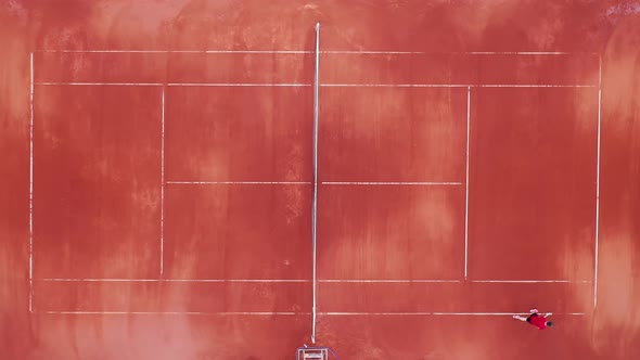 Top View of a Tennis Player Marking the Court