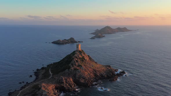 Aerial View Lighthouse on Mountain Rocky Hill in Sea Sunset