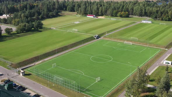 Top View of a Football Field with Green Grass Outdoors in Summer