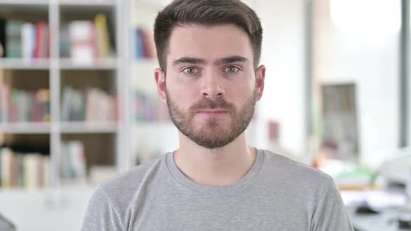 Portrait of Young Man Shaking Head To Reject, No