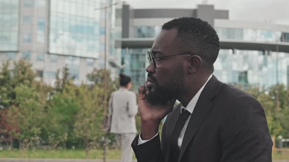 African-American Businessman Making Phone Call Outside