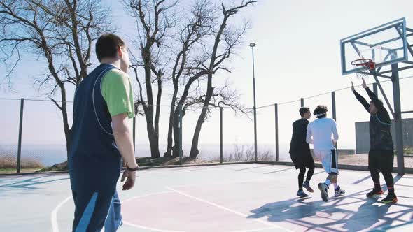 Group of People Playing Basketball Outdoors Slow Motion