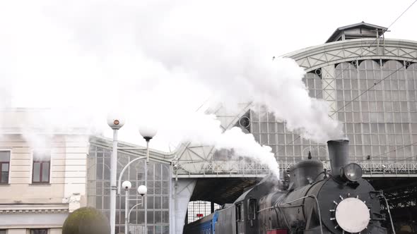 Retro Steam Train Departs From the Railway Station