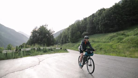 Cyclist Ride Bicycle at Mountain Road