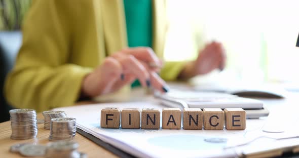 Word Finance and Businesswoman Considers Budget of Company